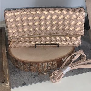 New Sole Society rose gold clutch.